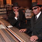 Grammy-winning producers Jimmy "Jam" Harris, left, and Terry Lewis, right, pose in one of their recording studios at Flyte Tyme in Edina, Minn., Tuesday, Oct. 21, 1997. For 15 years, Jam and Lewis have been writing and producing hits for such stars as Janet Jackson, Boyz II Men, Mary J. Blige, Herb Alpert, Jon Secada, New Edition and Johnny Gill.  (AP Photo/Ann Heisenfelt)