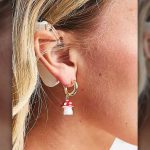 earring ad, model with hearing aid