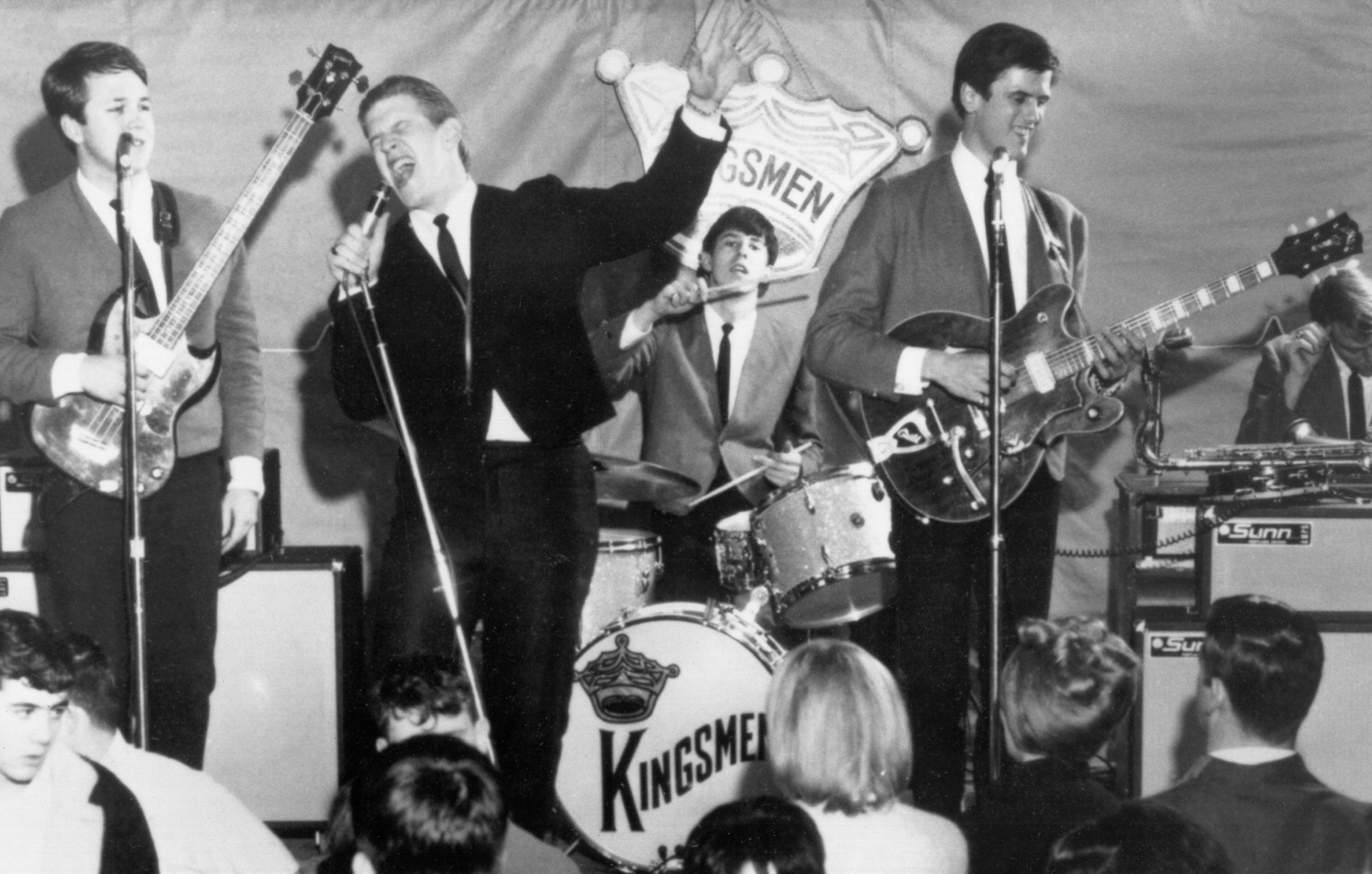CIRCA 1964:  (L-R) Norm Sundholm, Lynn Easton, Dick Peterson, Mike Mitchell, and Barry Curtis of the touring version of the rock and roll band "The Kingsmen" perform onstage in 1964. (Photo by Michael Ochs Archives/Getty Images)