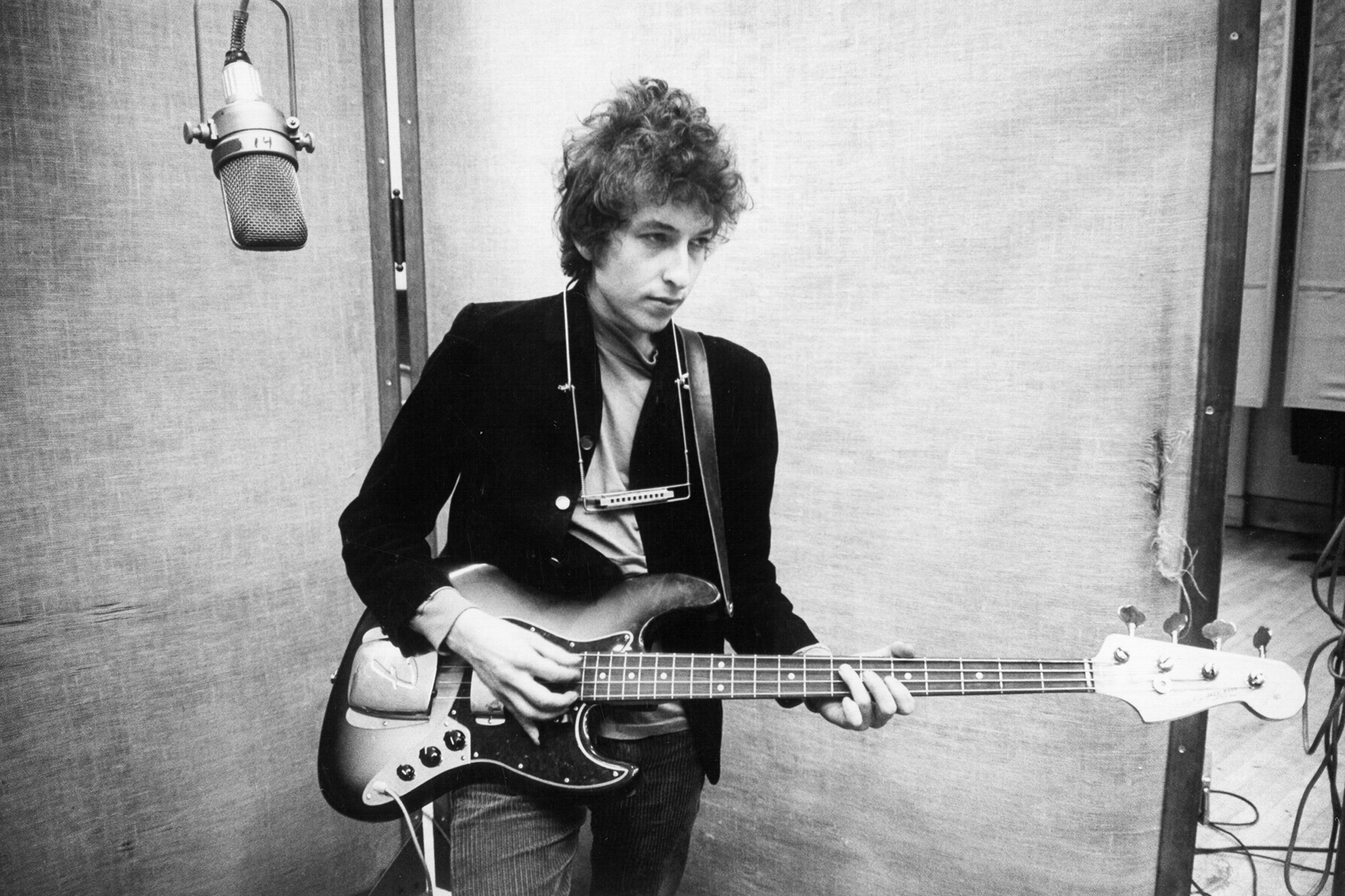 NEW YORK - JANUARY 13-15: Bob Dylan plays a Fender Jazz bass with the harmonica around his neck while recording his album 'Bringing It All Back Home' on January 13-15, 1965 in Columbia's Studio A in New York City, New York. (Photo by Michael Ochs Archives/Getty Images)