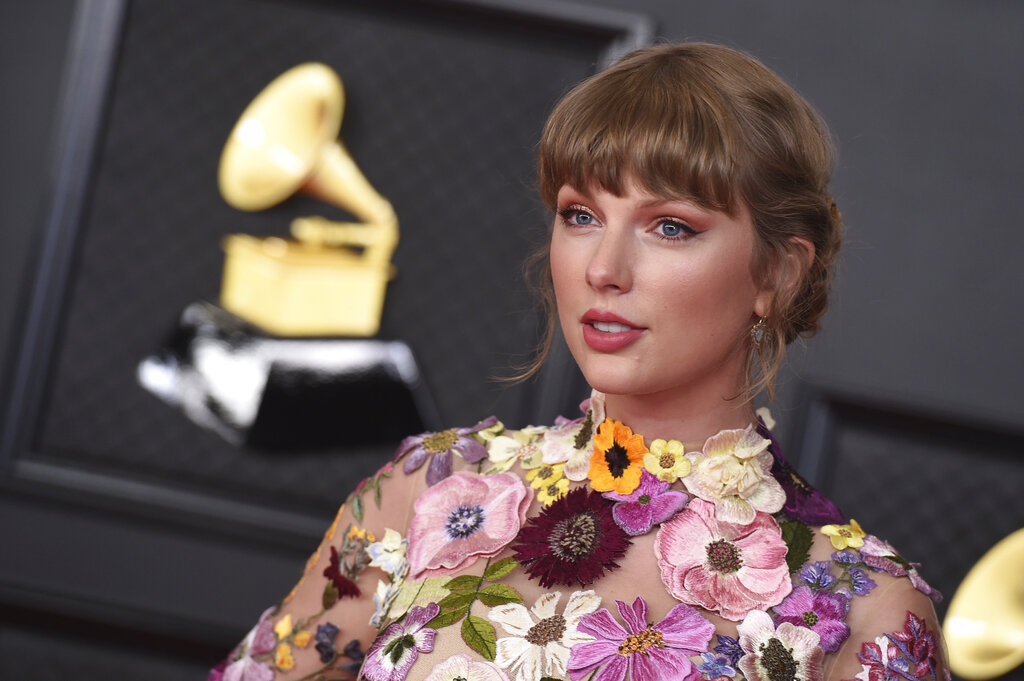 Taylor Swift poses in the press room at the 63rd annual Grammy Awards at the Los Angeles Convention Center on Sunday, March 14, 2021. (Photo by Jordan Strauss/Invision/AP)