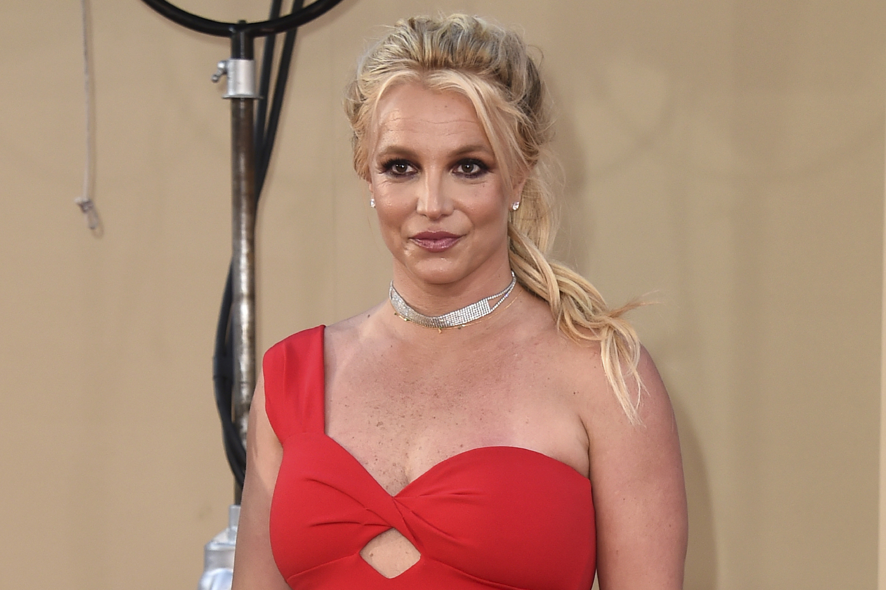 FILE - Britney Spears arrives at the Los Angeles premiere of "Once Upon a Time in Hollywood" on July 22, 2019. When Spears speaks to a judge at her own request on Wednesday, June. 23, 2021, she'll do it 13 years into a court-enforced conservatorship that has exercised vast control of her life and money by her father. Spears has said the conservatorship saved her from collapse and exploitation. But she has sought more control over how it operates, and says she wants her father out. (Photo by Jordan Strauss/Invision/AP, File)