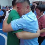 China man hugging his son