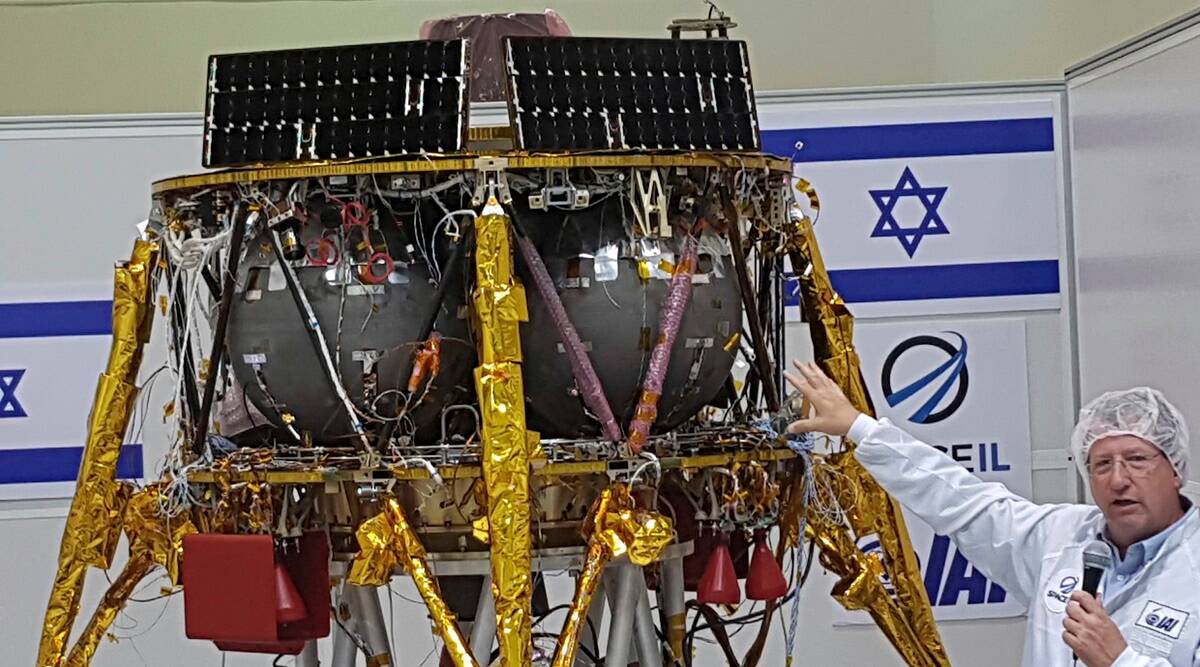 In this July 10, 2018 file photo, Opher Doron, general manager of Israel Aerospace Industries' space division, speaks beside the SpaceIL lunar module, during a press tour of their facility near Tel Aviv, Israel.
