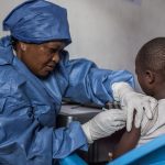 A girl gets inoculated with an Ebola vaccine on November 22, 2019 in Goma, the Democratic Republic of the Congo