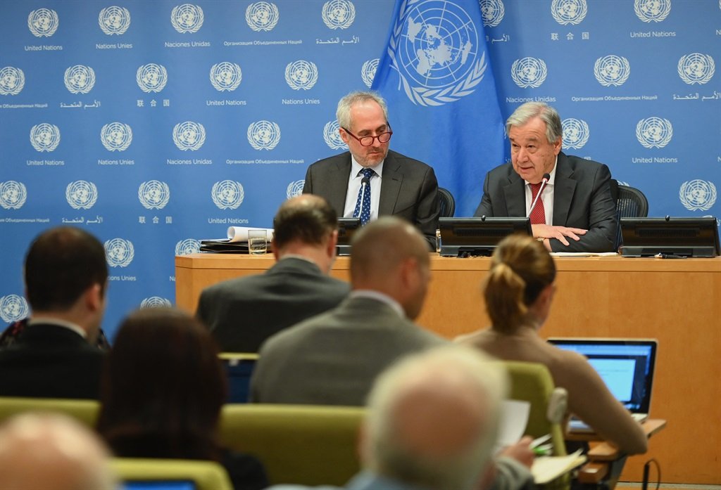 United Nations Secretary General Antonio Guterres with Stephane Dujarric (L), spokesperson for the Secretary General speaks during a press briefing at United Nations Headquarters in New York City.