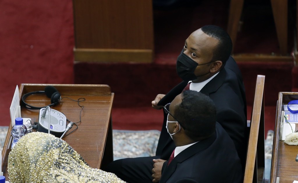Abiy Ahmed Ali (R) took the oath of office during the joint session of the House of Peopleâs Representatives and House of the Federation held on Monday in Addis Ababa, Ethiopia on October 4, 2021.