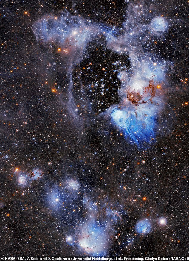El Hubble ha descubierto una 'superburbuja' dentro de una nebulosa en el espacio profundo.  La 'superburbuja', un área sin estrellas, tiene aproximadamente 250 años luz de ancho y es 'algo misterioso', dijo la NASA.