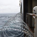 Barbed wire attached to the ship hull, superstructure and railings to protect the crew against piracy attack in the Gulf of Guinea in West Africa. (File)