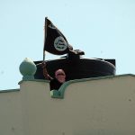 A man waves an Al-Shabaab flag.