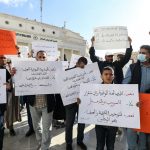 Local NGO activists gather for a demonstration at Algeria Square outside the Tripoli Municipality in the Libyan capital on December 15, 2021, to protest against any possible postponement of the upcoming elections scheduled for December 24.
