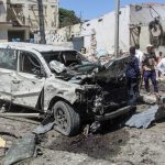 A  general view of the scene of a car-bomb explosion in Mogadishu on January 12, 2022 where at least six people were killed and several others wounded in the huge blast that caused devastation in the area along the 21st October road.
At least six people were killed and undisclosed number of others wounded after a huge car bomb explosion rocked along a road in southern Mogadishu causing casualties and devastation.
STRINGER / AFP
