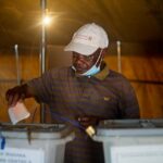 A man cast a ballot during a by-election at a polling station on in Mbizo township, Kwekwe.