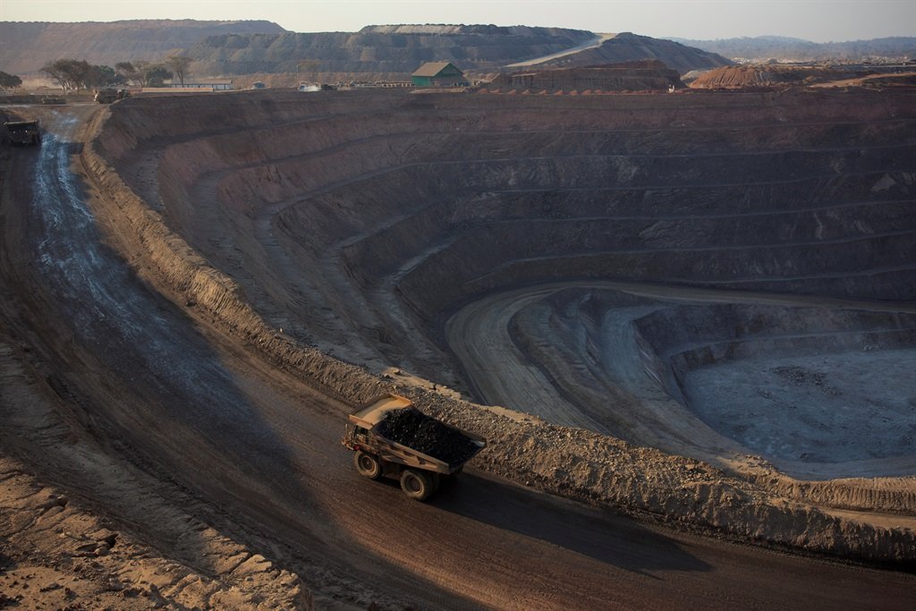 A truck carries a load of ore to the processing plant at an open pit copper mine in the DRC (Photo by Per-Anders Pettersson/Getty Images)