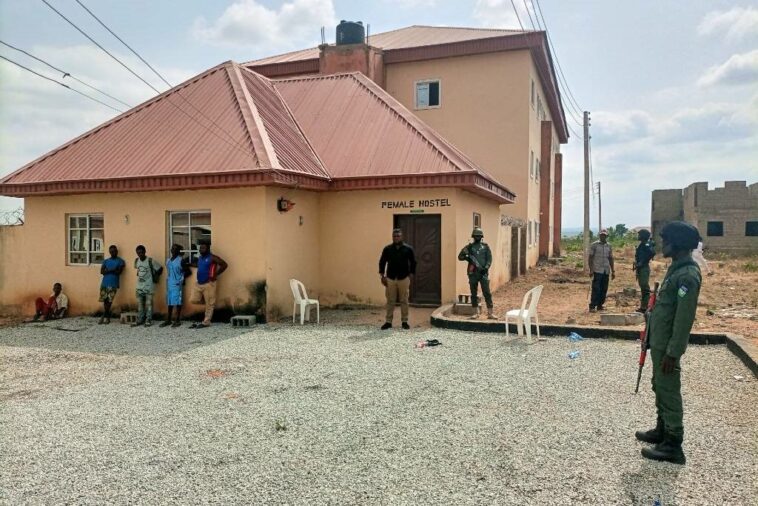 Security personnel stand at a female hostel at the Greenfield University in Kaduna, Nigeria on 21 April 2021.