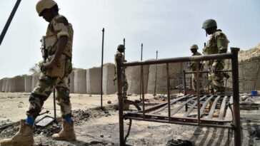 Niger's soldiers stand at Bosso military camp on June 17, 2016 following attacks by Boko Haram fighters in the Diffa region.