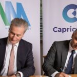 NewMed Energy CEO Yossi Abu signs merger with Capricorn CEO Simon Thomson credit: NewMed Energy