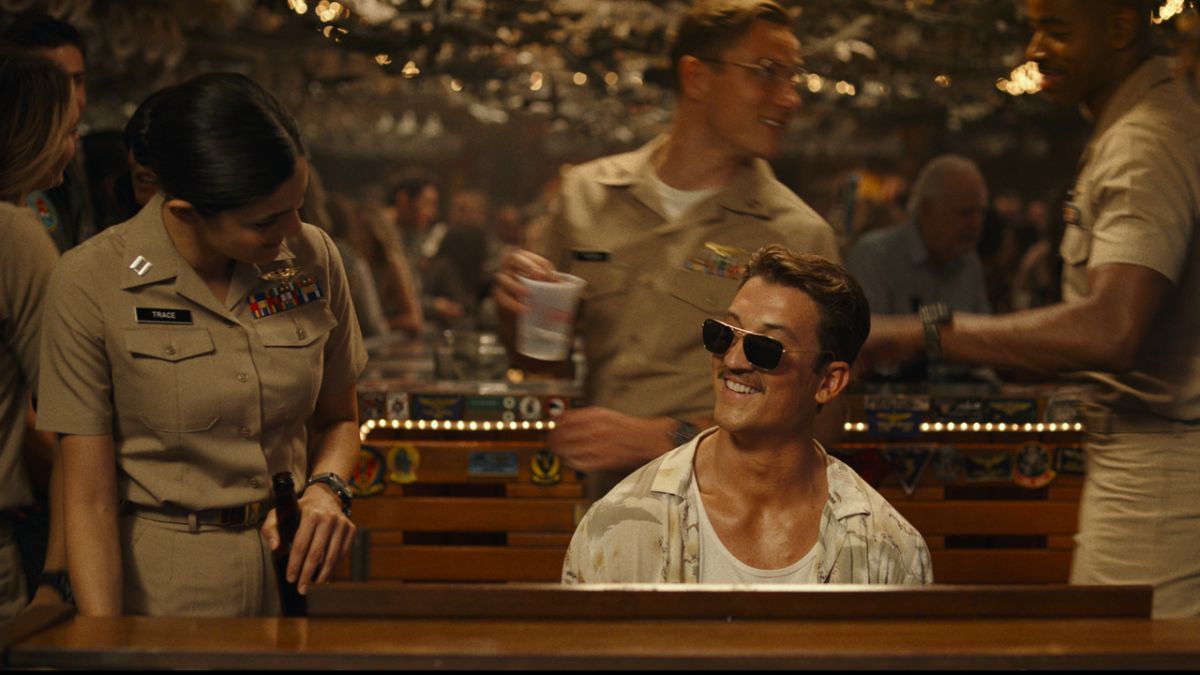 Miles Teller playing piano in Top Gun: Maverick