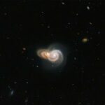 Hubble image shows two spiral galaxies seemingly overlapping