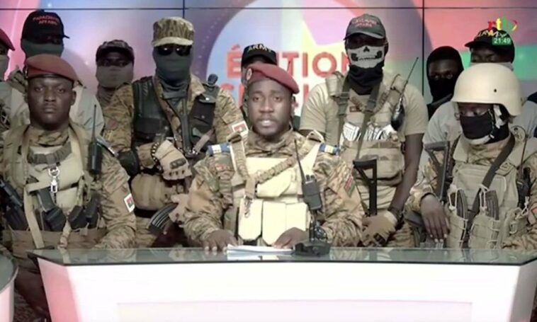A screen grab shows from state TV, army Capt. Kiswendsida Farouk Azaria Sorgho reads a statement in Ougadougou, Burkina Faso. (Photo by Radio Television du Burkina (RTB)/Anadolu Agency via Getty Images)