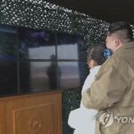 N.K. state TV releases photos of leader Kim, his daughter, for 2nd straight day