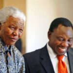 Former South African president, Nelson Mandela, and Cyril Ramaphosa, sharing a humorous moment.