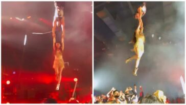 Akshay Kumar se cuelga del arnés, sostiene las manos de Mouni Roy para levantarla durante el espectáculo de Orlando.  Mirar