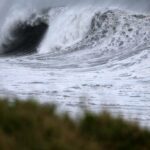 High waves crash along the shore as cyclone approa