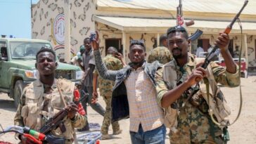 Sudanese army soldiers, loyal to army chief Abdel Fattah al-Burhan, pose for a picture at the Rapid Support Forces (RSF) base in the Red Sea city of Port Sudan.
