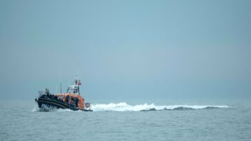 A RNLI (Royal National Lifeboat Institution) lifeboat carrying migrants.