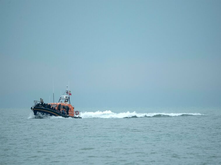 A RNLI (Royal National Lifeboat Institution) lifeboat carrying migrants.