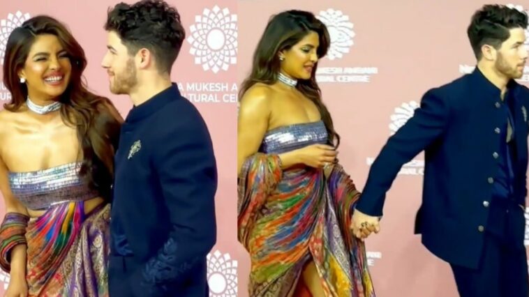 Priyanka Chopra no puede dejar de sonreír cuando llega de la mano de Nick Jonas al evento del día 2 de NMACC.  Mirar