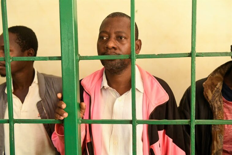 Self-proclaimed pastor Paul Nthenge Mackenzie, (C) who set up the Good News International Church in 2003 and is accused of inciting cult followers to starve to death "to meet Jesus", appears at the Shanzu law courts in Mombasa on 5 May 2023.