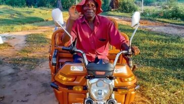Matius Khumbula on his e-tricycle.