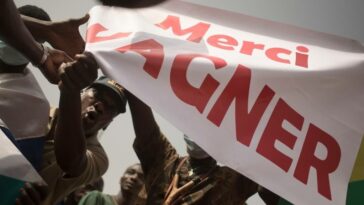 Protesters holds a banner reading 'Thank you Wagner', the name of the Russian private security firm present in Mali, during a demonstration organised by the pan-Africanist platform Yerewolo to celebrate France's announcement to withdraw French troops from Mali, in Bamako.