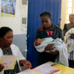 Mothers wait in line to have their babies vaccinated against measles at a healthcare center in Larintsena, Madagascar.