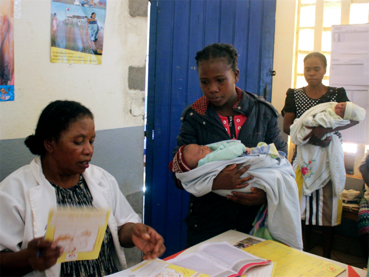 Mothers wait in line to have their babies vaccinated against measles at a healthcare center in Larintsena, Madagascar.
