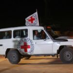 Red Cross ambulace with Israeli hostages credit: Reuters Ibraheem Abu Mustafa