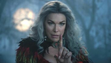 Hannah Waddingham holds a finger up in warning in Hocus Pocus 2.
