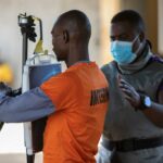 A medical staffer performs an X-ray scanner on an inmate at the general prison in Maputo on 6 November 2023. (Photo by Alfredo ZUNIGA / AFP)