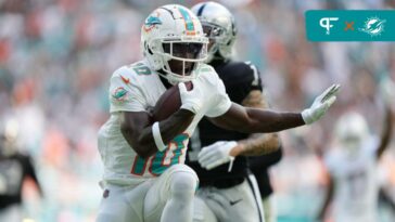 Miami Dolphins wide receiver Tyreek Hill (10) scores a touchdown during the first half of an NFL game against the Las Vegas Raiders at Hard Rock Stadium in Miami Gardens, Nov. 19, 2023.