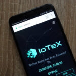 IOTX logo on a mobile phone screen