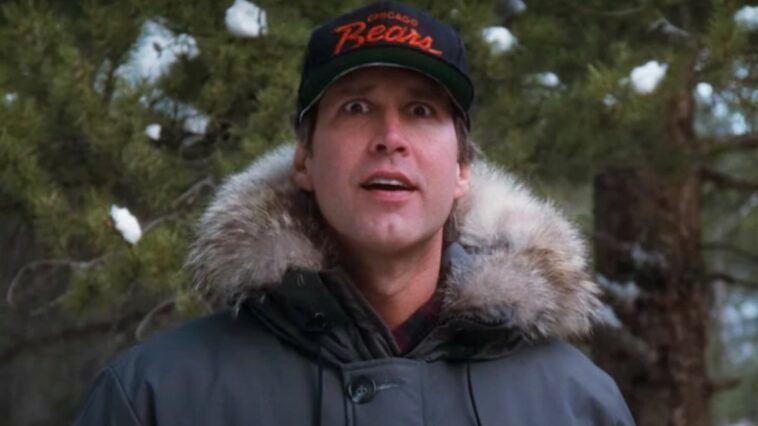 Chevy Chase looking a tree in National Lampoon