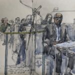 This court sketch made on 14 November 2023, shows Rwandan former doctor Sosthene Munyemana (R) attending his trial on charges of genocide and crimes against humanity during the 1994 massacres in Rwanda, at the Palais de Justice courthouse on the Ile de la Cite, central Paris.