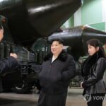 (LEAD) N. Korean leader inspects factory producing launchers for solid-fuel ICBMs