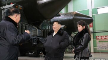 (LEAD) N. Korean leader inspects factory producing launchers for solid-fuel ICBMs