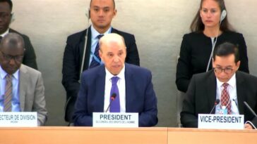 The newly elected president of the UN Human Rights Council, Ambassador Omar Zniber (centre), of Morocco