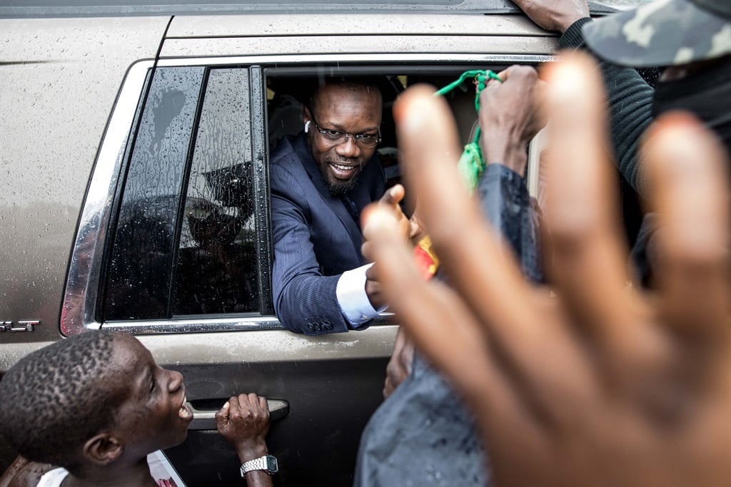 Ousmane Sonko, President of the opposition party Senegalese Patriots for Work, Ethics and Brotherhood (PASTEF), waves to his supporters.