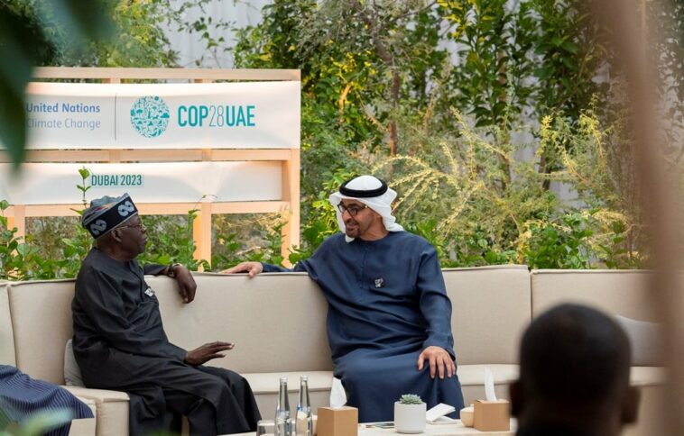 Nigeria's Bola Ahmed Tinubu meets with President of the United Arab Emirates Sheikh Mohamed bin Zayed Al Nahyan on the sidelines of COP28 in December 2023, a summit for which Nigeria fielded a 1 400 delegates. (Photo by Ryan CARTER / UAE PRESIDENTIAL COURT / AFP)