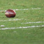 An official NFL football on the field.